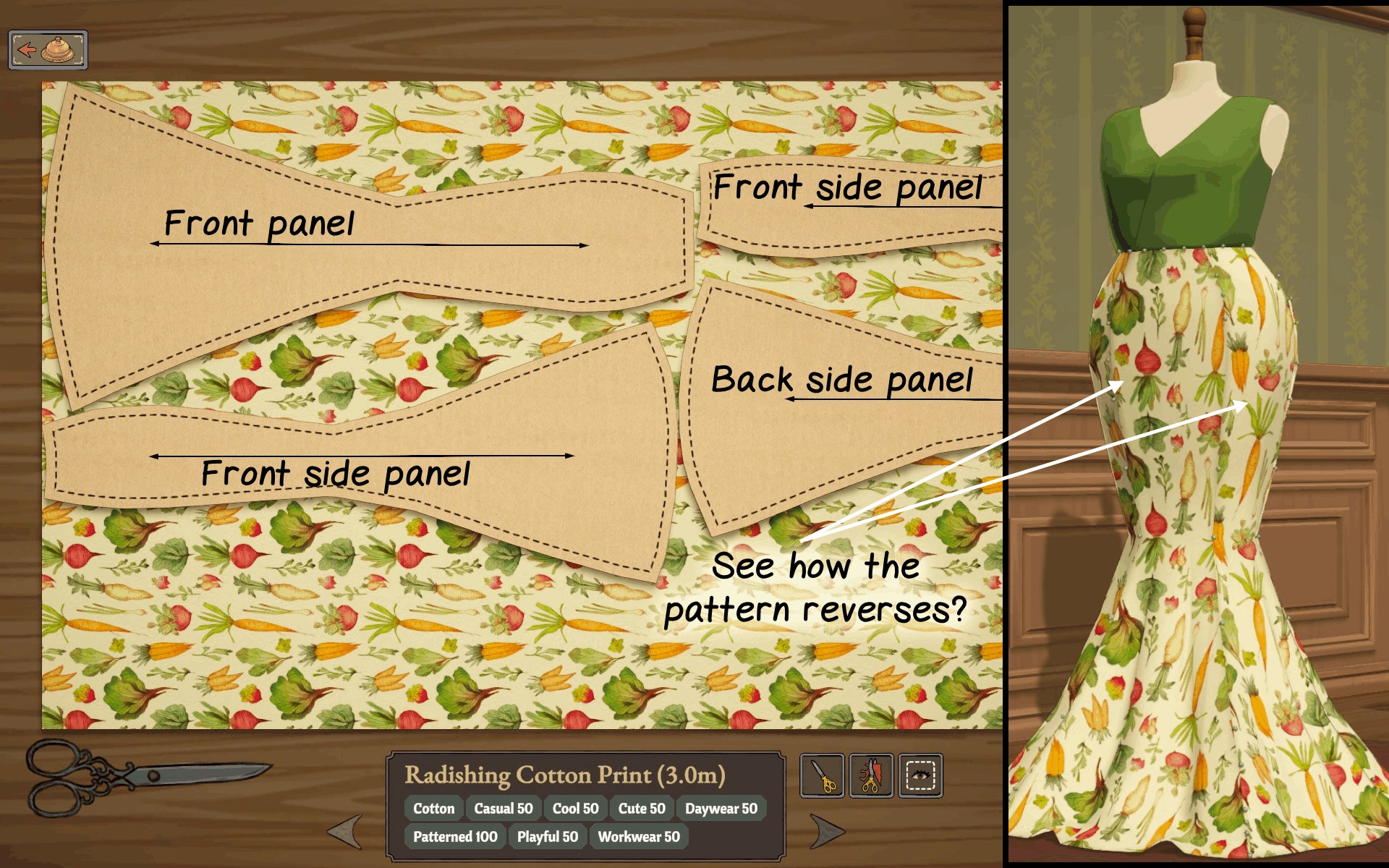 Cutting table with a vegetable print cotton laid out with labelled front and back panels, and the finished dress beside it showing the print reversing direction between panels